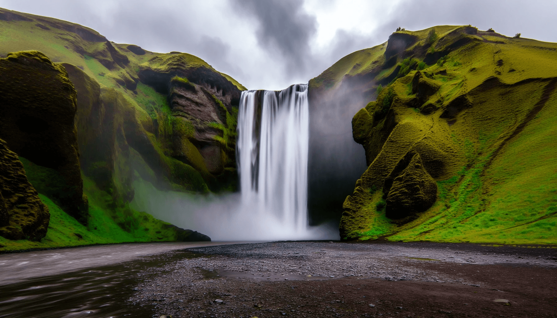 A scenic view of Skógafoss waterfall, one of the stunning sights along Iceland's southern coast