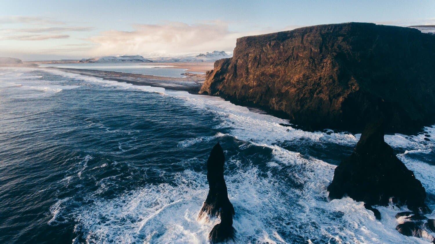Reynisfjara black sand beach with basalt sea stacks
